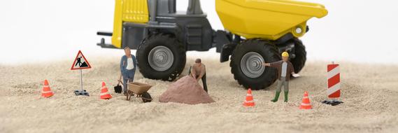 figures of road workers and construction equipment