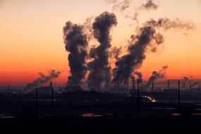 dark smoke from Industry plant at Sunrise
