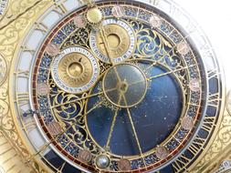 Beautiful and decorated, gold clock monument in Czech Republic