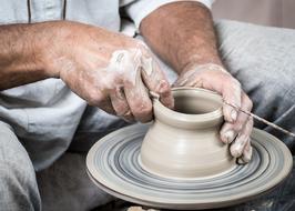 making a jug on a potter's wheel