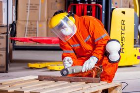 worker in overalls and goggles