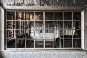 Beautiful, old, abandoned house with the windows and furniture