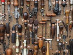the tools are hanging on the wall