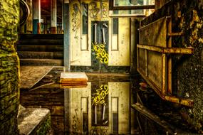 Landscape of the old building, with the elevator and colorful graffities and water