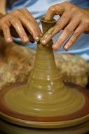 Potterâs Hands working with Clay