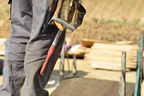 Construction Worker with hammer for nails