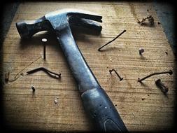 Hammer and Nails on Wooden surface