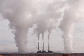 thick smoke from factory chimneys
