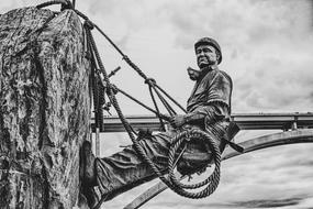 black and white photo of a miner sculpture