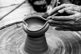 Black And White photo of Nails Hands making pot