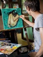 young Artist painting girl in studio