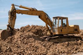 excavator is dripping earth
