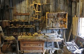 Interior of the wooden workshop with a lot tools in light