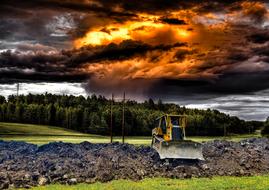 Bulldozer Work on a field and dramatic sky