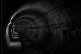 black and white subway tunnel