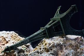 abstract photo of Eiffel tower fallen on stones