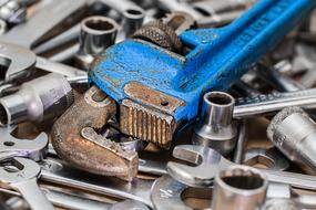 blue wrench among metal bits