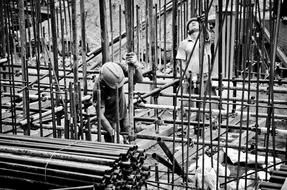 Black and white photo with the workers at the subway construction site