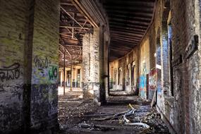 Inside of the old, abandoned factory with colorful graffities