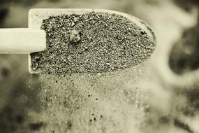 Sand falling from shovel