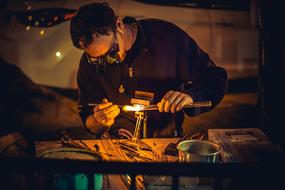 man working with glassware