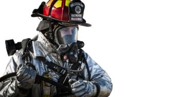 fireman in a protective helmet and gas mask