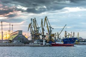 cargo ship in harbor beside of cranes, bulgaria, burgas
