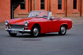 red open Oldtimer Auto on pavement