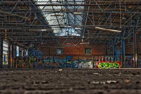 graffiti on the walls in an abandoned factory