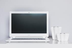 White Acer Chromebook 13 laptop, on the white table