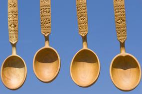 wooden spoons on a blue background