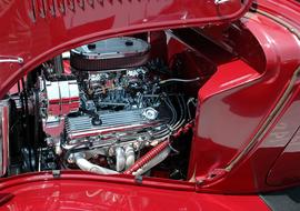 open hood of red vintage Car