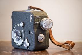 vintage camcorder with a leather strap
