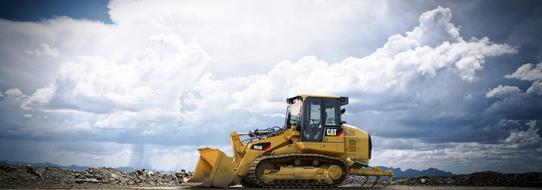 yellow excavator cleans the landfill