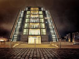 Beautiful Dockland with colorful lights, in the harbor of Elbe, in Hamburg, Germany, at the night