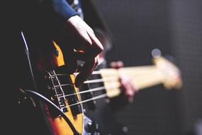 guitarist hands on guitar strings