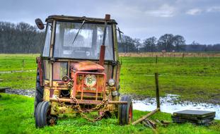old rusty tractor on Field