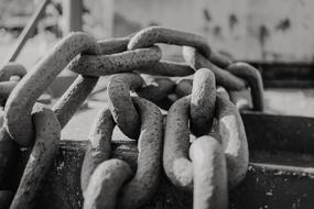 black and white photo of an industrial chain
