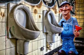 plumber figurine near the toilet