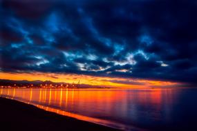 blue cloudy sky over spain coast at dusk