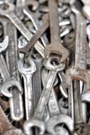 lot of wrenches on a blurred background