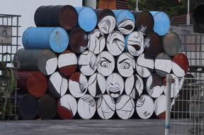 graffiti in the form of a girl on containers