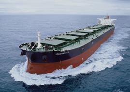 Big ship in the water with white waves