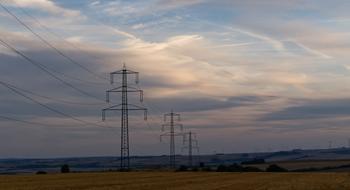 Landscape of Power Lines Strommast on a field