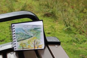 autumn landscape, Sketch in Sketchbook on bench outdoor