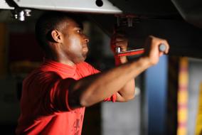 man behind maintenance on blurred background