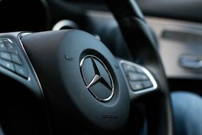 steering wheel of Mercedes close-up on blurred background