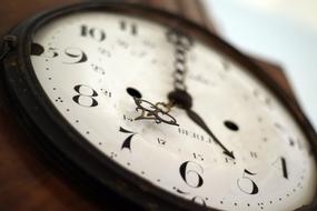 Close-up of the beautiful, old clock with arrows