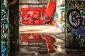 multi-colored graffiti on the walls of an abandoned building