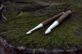 two Crochet Hook on weathered wooden surface